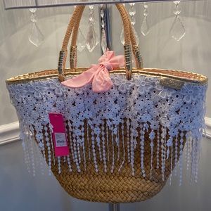 Beautiful Brand new Lilly Pulitzer wicker purse with floral fringes.